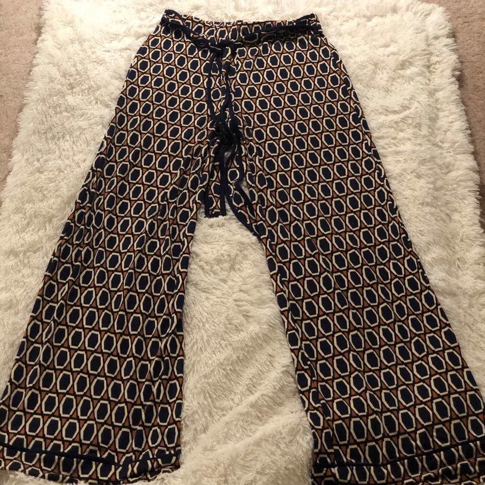 Flare orange white and blue comb print pants